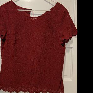 Red  blouse with scalloped arms and waist